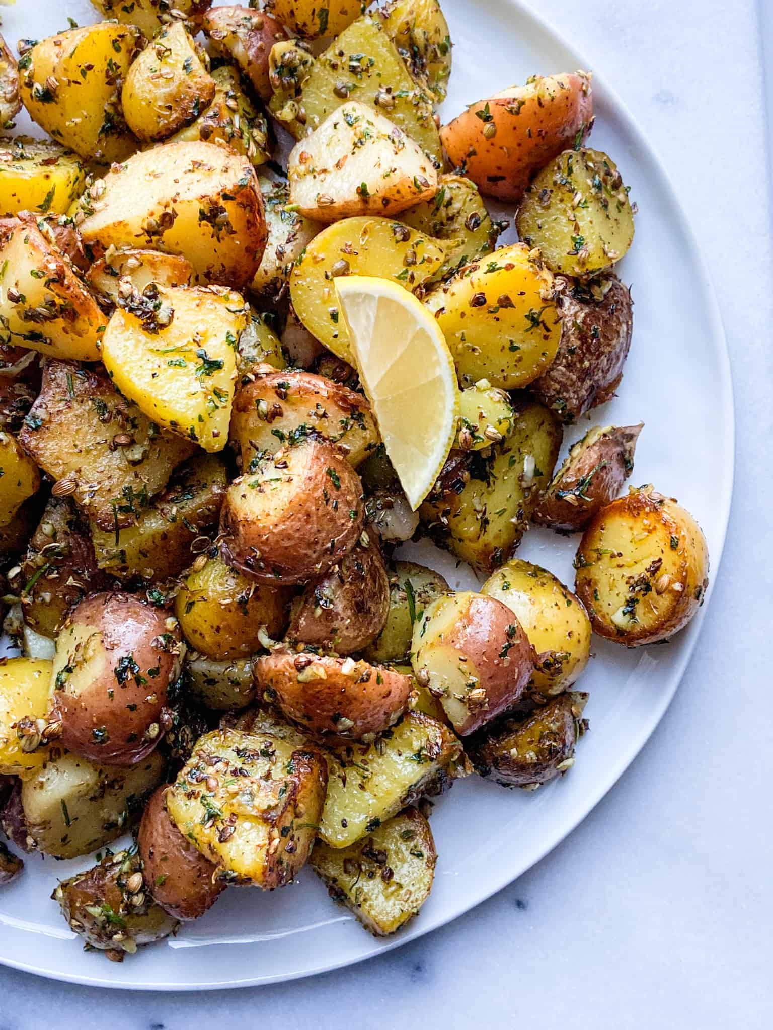 Garlic & Coriander roasted potato. Best garlic roasted potato recipe.