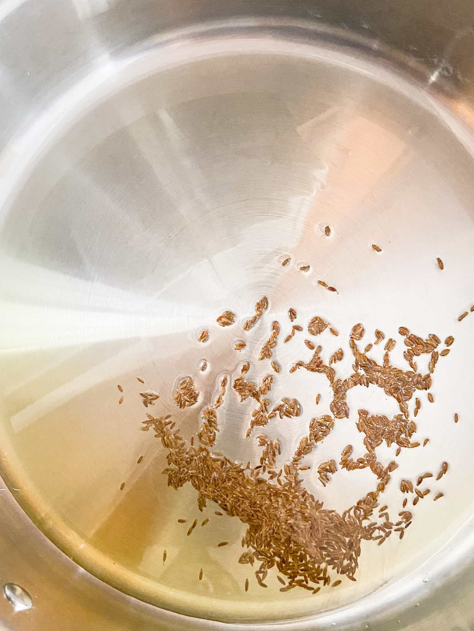 temper cumin seeds in hot oil until it changes color.