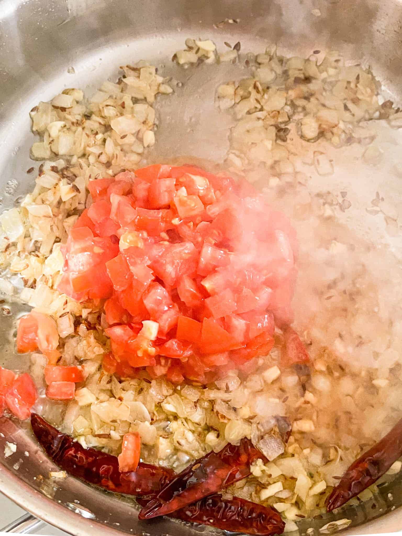 add diced tomatoes once the ginger and garlic is cooked.