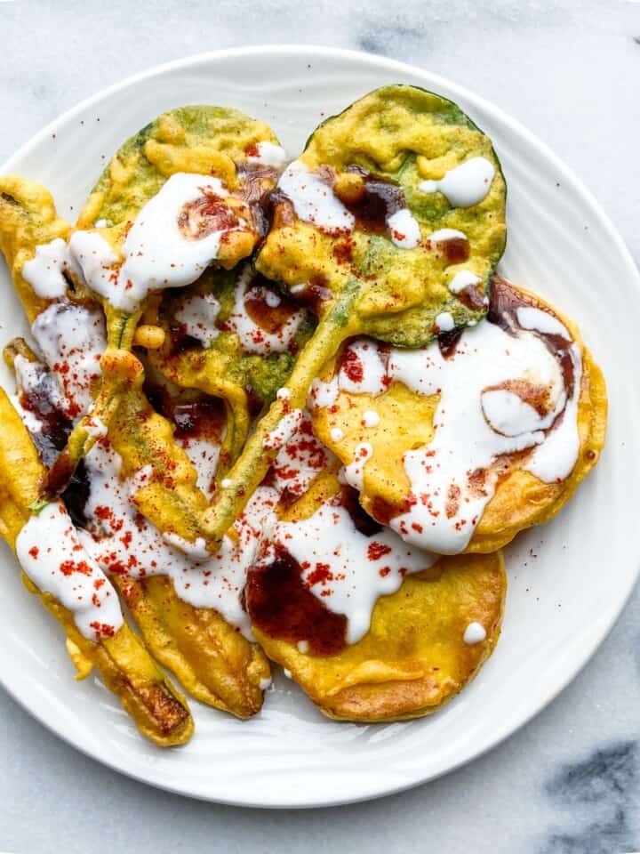 Indian fritters with yogurt, chutney and chili powder