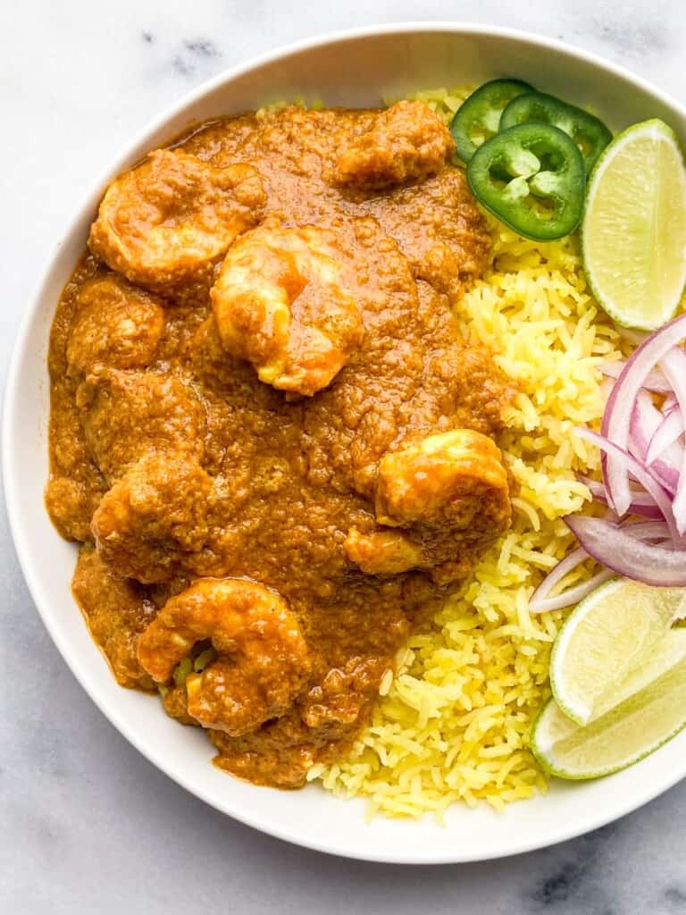 Indian shrimp curry with turmeric rice in a bowl