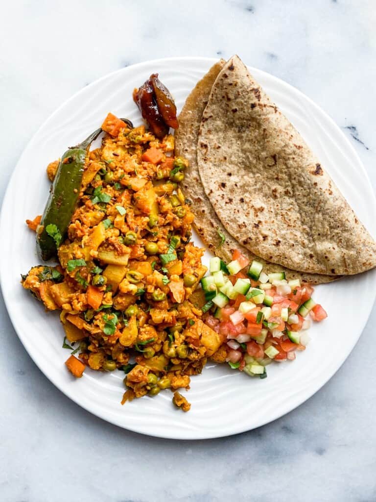 Indian cauliflower dish with flatbread on a plate