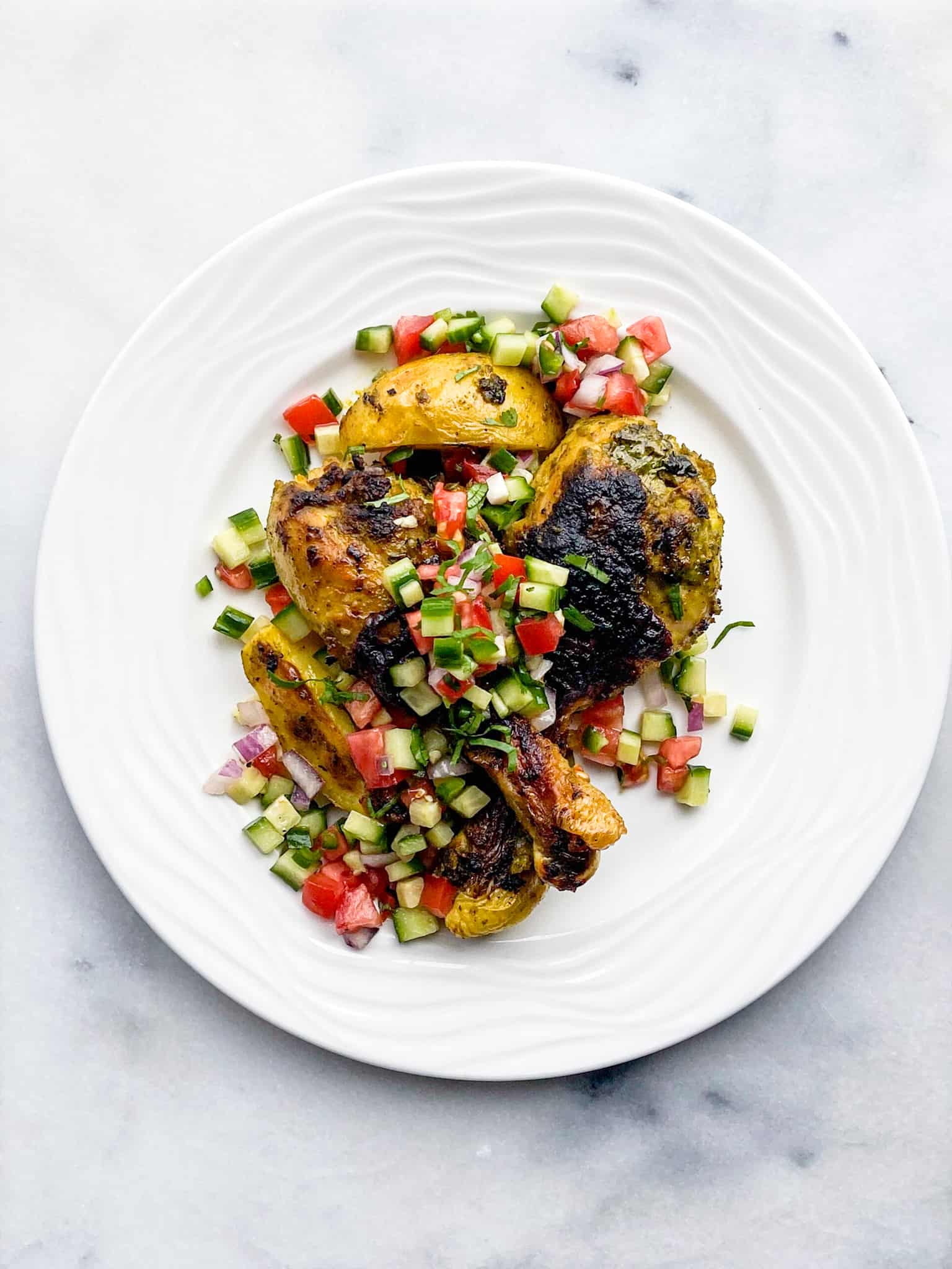 Indian sheet pan chicken with potatoes with salad