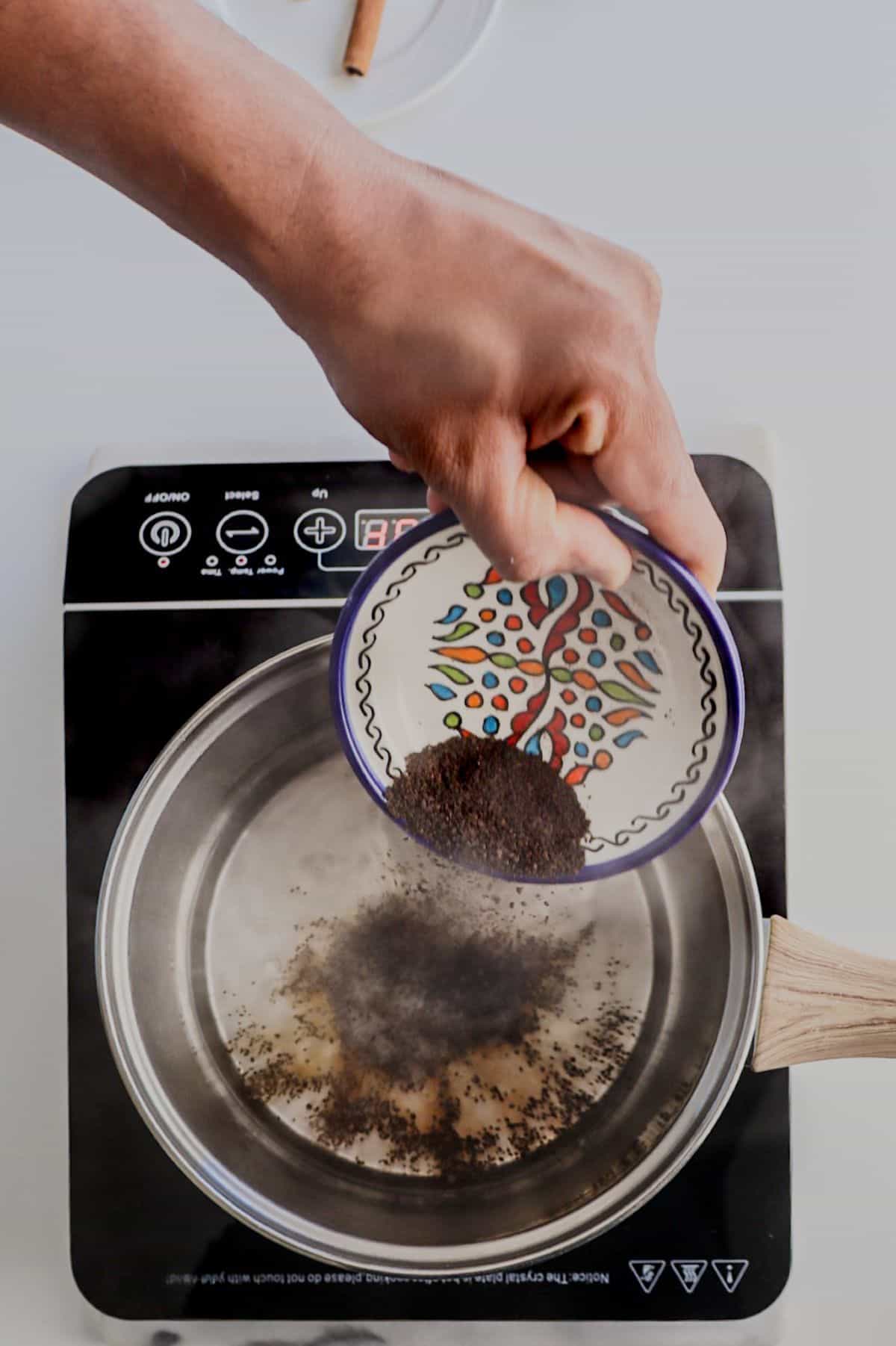 Adding tea to boiling water
