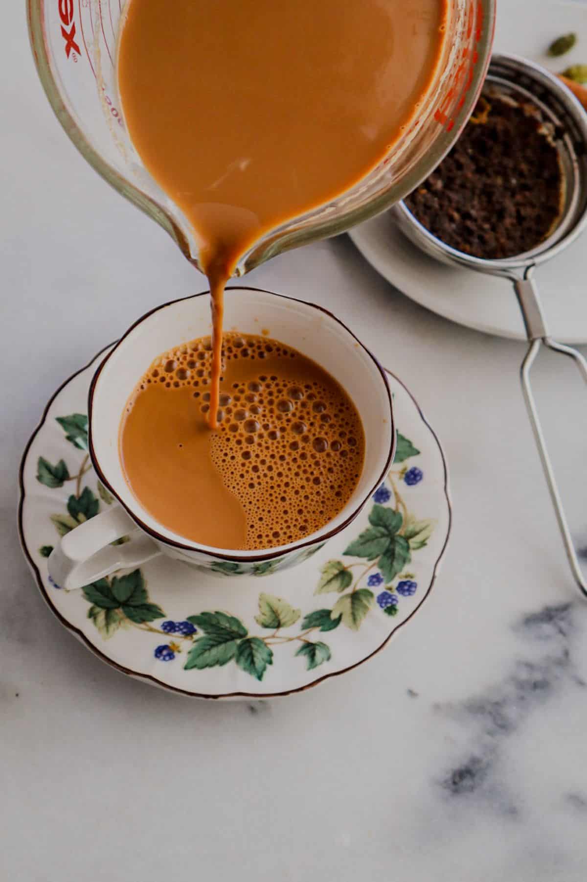 Pouring tea in a cup