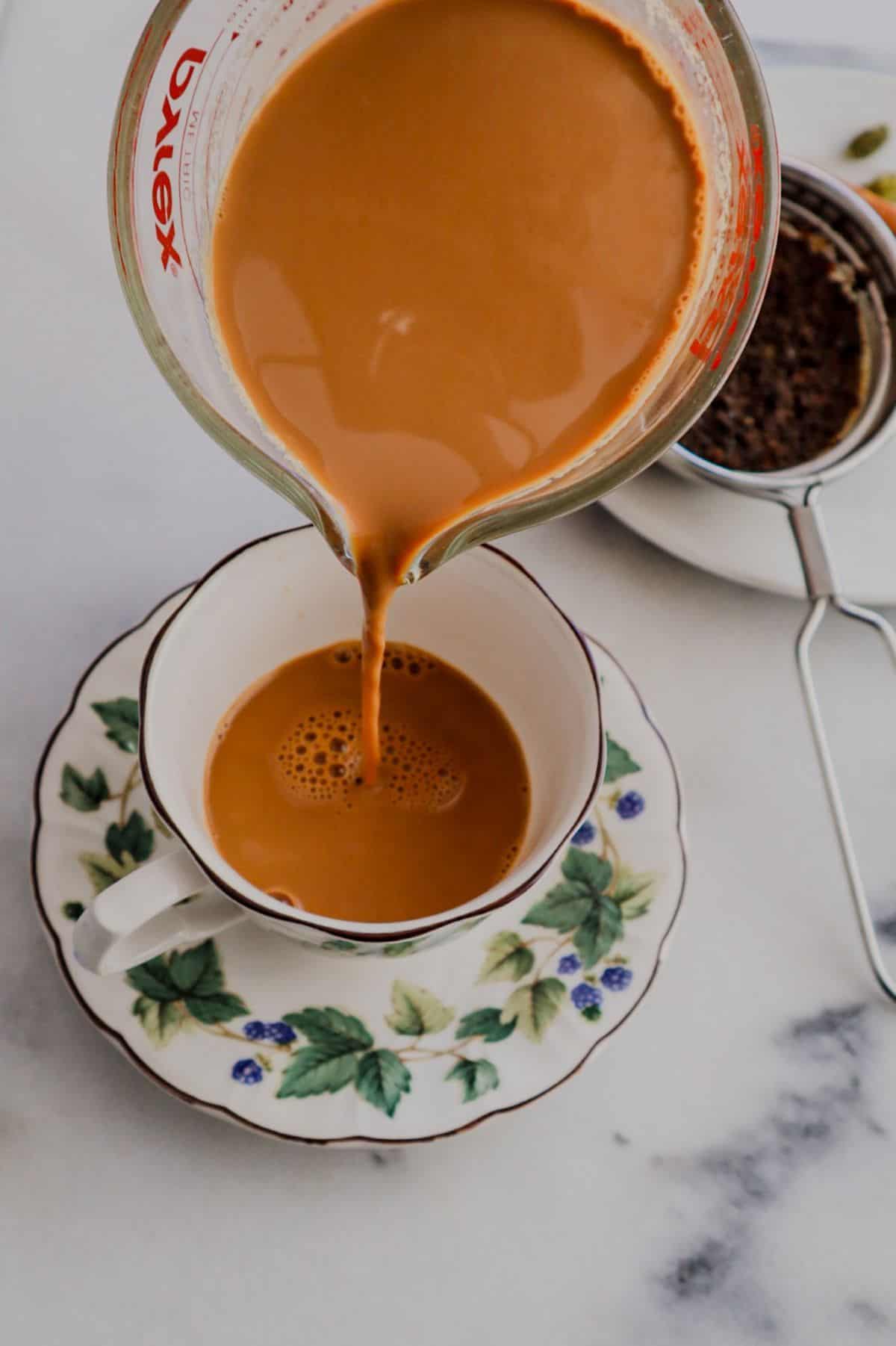 Chai pouring in a cup
