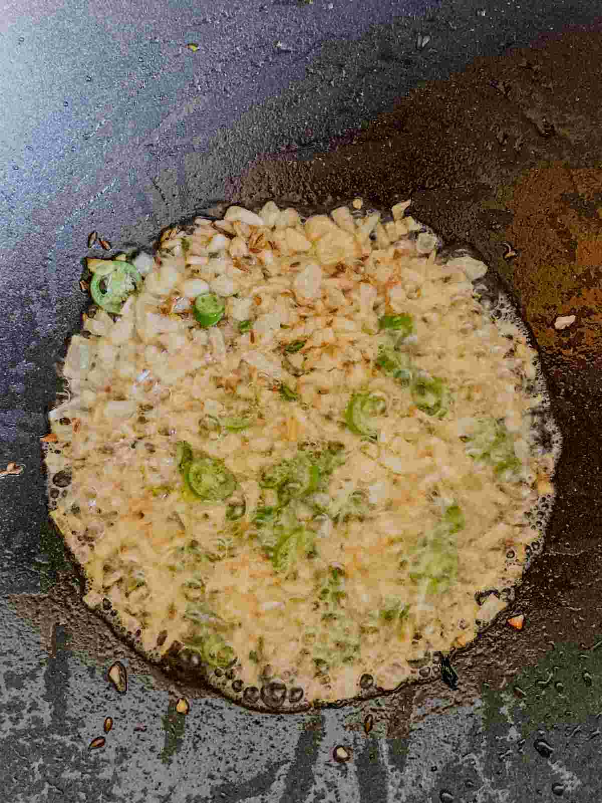 Onion, garlic, green chili and cumin sautéed until fragrant