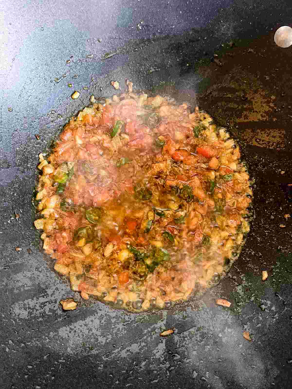 Tomato masala cooking until oil separates